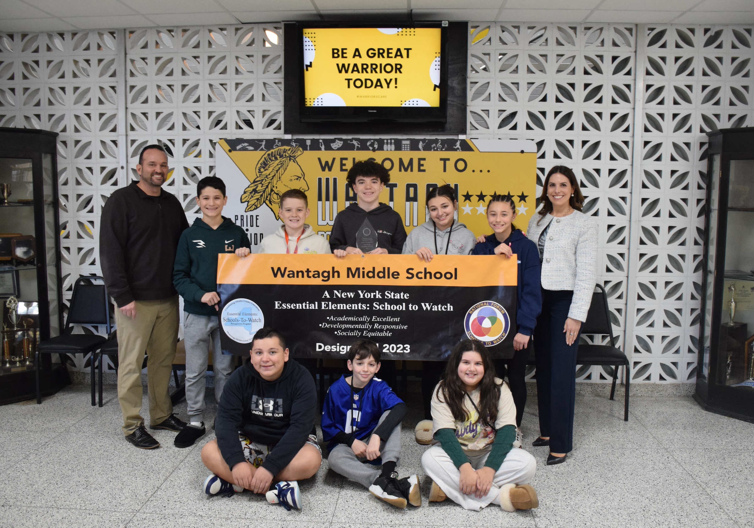students holding sign